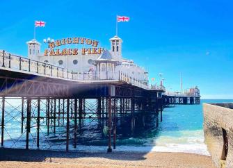 View of the entrance to Brighton Palace Pier looking out to sea.