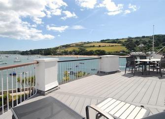 An estuary view from a deck of a waterside holiday apartment in Salcombe.