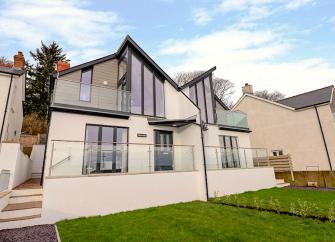 2 storey contemporary house with floor to ceiling windows, terrace nd garden