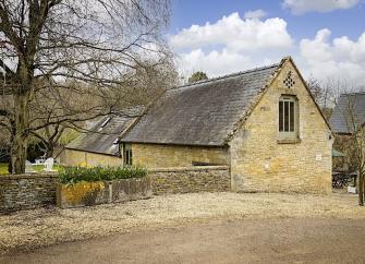 A Cotswold Farm Barn Conversion within a walled garden