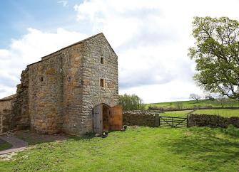 Exterior of a 3-storey, farmhouse in Derbyshire.