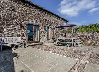 Exterior and courtyard of a stone-built, Exmoor barn conversion