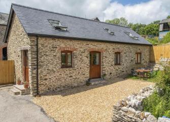 An Exmoor stone barn conversion within a courtyard in the North Devon countryside