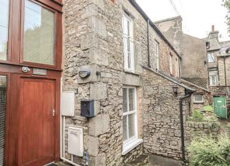 1st floor exterior of a stone-built Kendal holiday cottage.