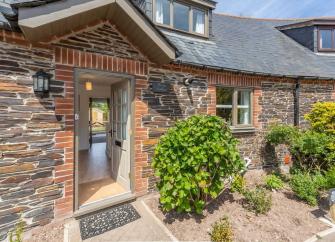 Exterior of a Cornish stone-built chalet bungalow