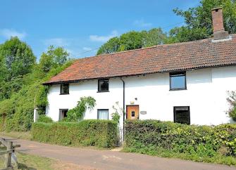 An Exmoor cottage overlooks a quiet country lane.