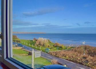 Sea views from a beach-front villa window in Filey