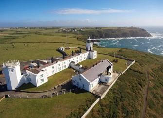 A lighthouse complex offers clifftop views along the North Cornwall coast.