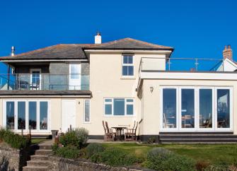 Large cottage with balcony and floor-to-ceiling French windows in Padstow.