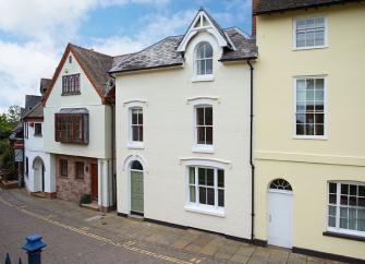 A mid-terrace, 3-storey town house overlooking a quiet street.