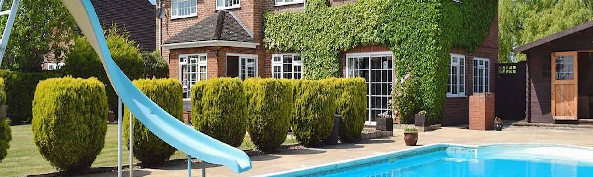 A Warwickshire holiday cottage with an outdoor pool and waterslide.