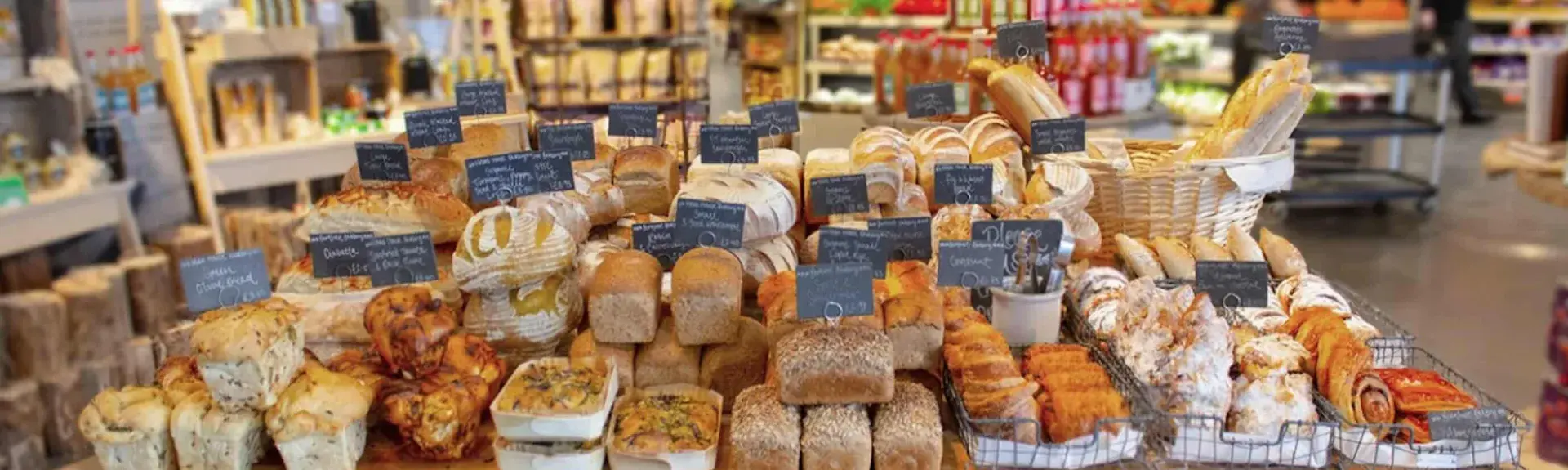 Rows of cakes and loafs in a Cotswold farmshop.