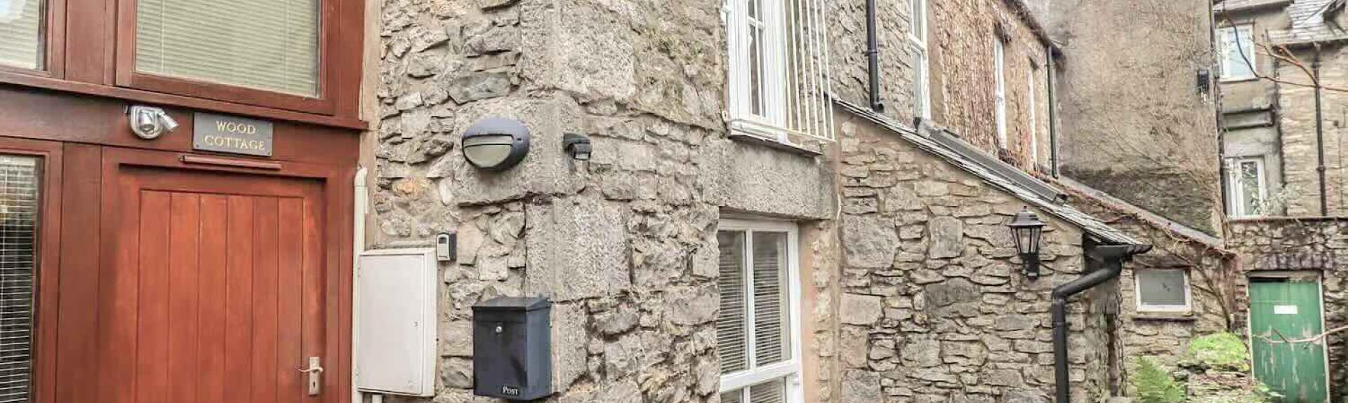 1st floor exterior of a stone-built Kendal holiday cottage.