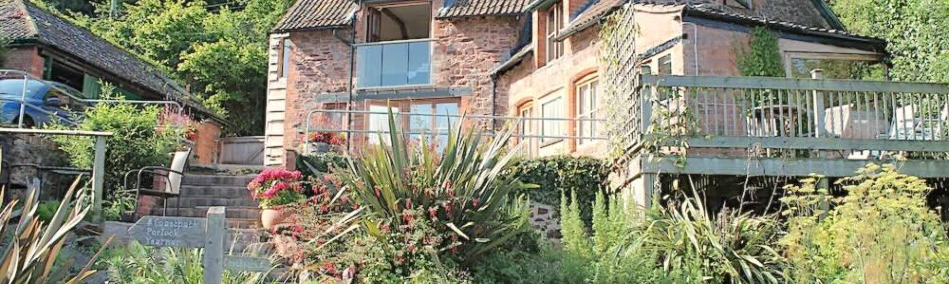 Large, 3-storey coastal holiday cottage surrounded by gardens in Porlock Weir