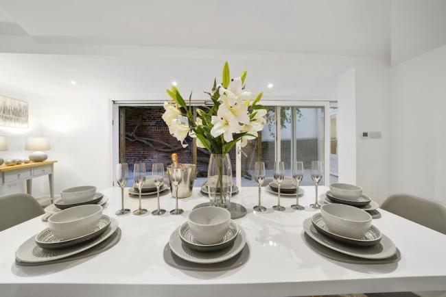 A table top laid with crockery