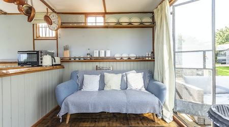 A convertable double bed in a cosy country shepherds hut in Somerset