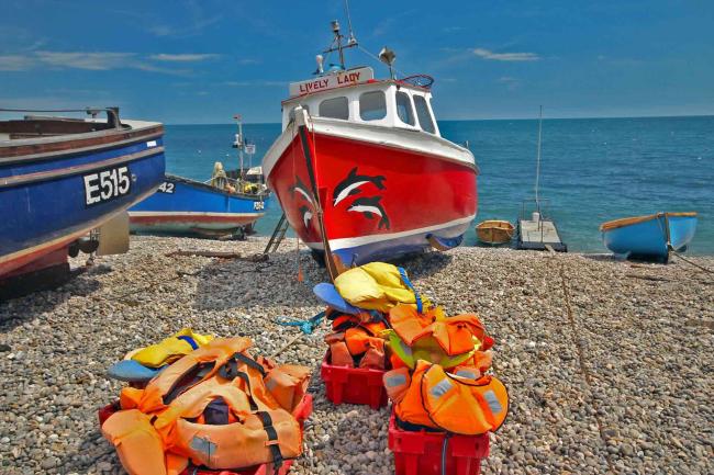 Fishing boats on a pebble beach at Beer in East Devon.