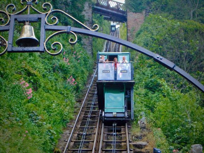 A carriage on a cliff railway ascended its steep track.