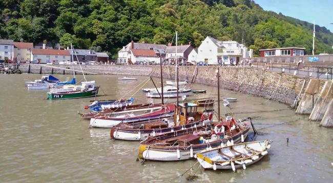 Fishing boats and small craft moored in rows in Minehead harbour